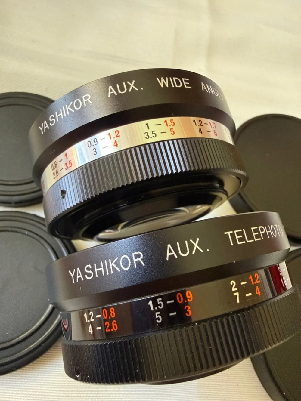 Set of 2 VTG Yashica Yashikor aux Telephoto & Wide Angle 1:4 Lens with cups